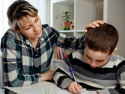 Mother consoles her son while concerned about Social Security Disability child support withholding by cloudlogix in houston, texas.