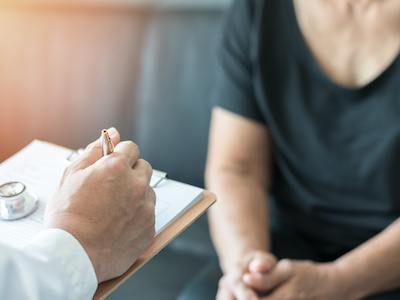 Woman seeks information from doctor to support SSDI consultative examination applying for disability benefits by disability apply houston texas